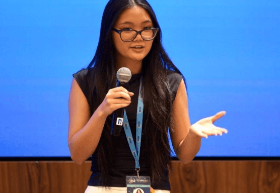 Cheri Ho, artist and founder of pAInter, speaking on stage